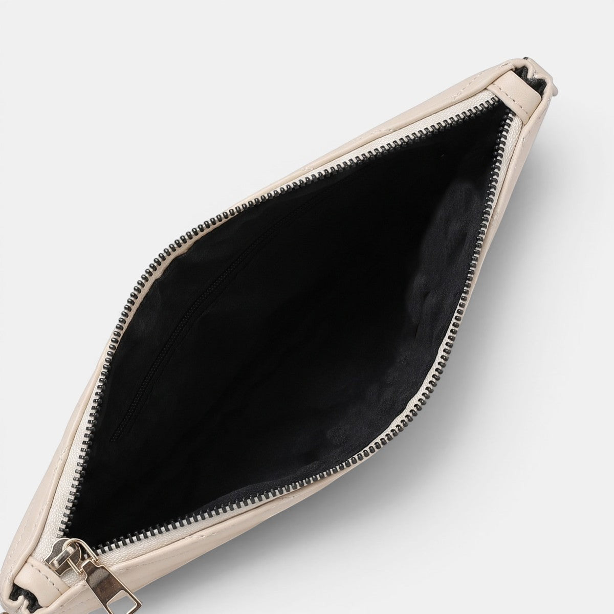 Lederax cream V-quilted faux leather clutch bag with silver hardware and black lining. Versatile design with multiple strap options.